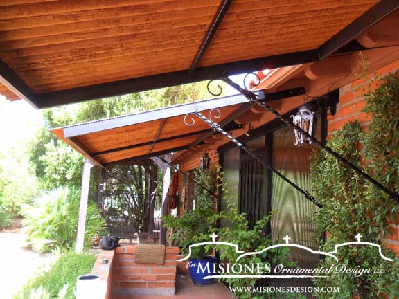 metal awning with wood covering windows and deck